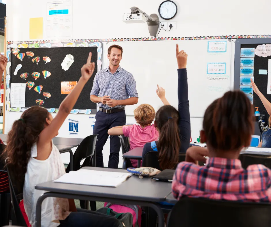 Teacher with students in a PVUSD classroom